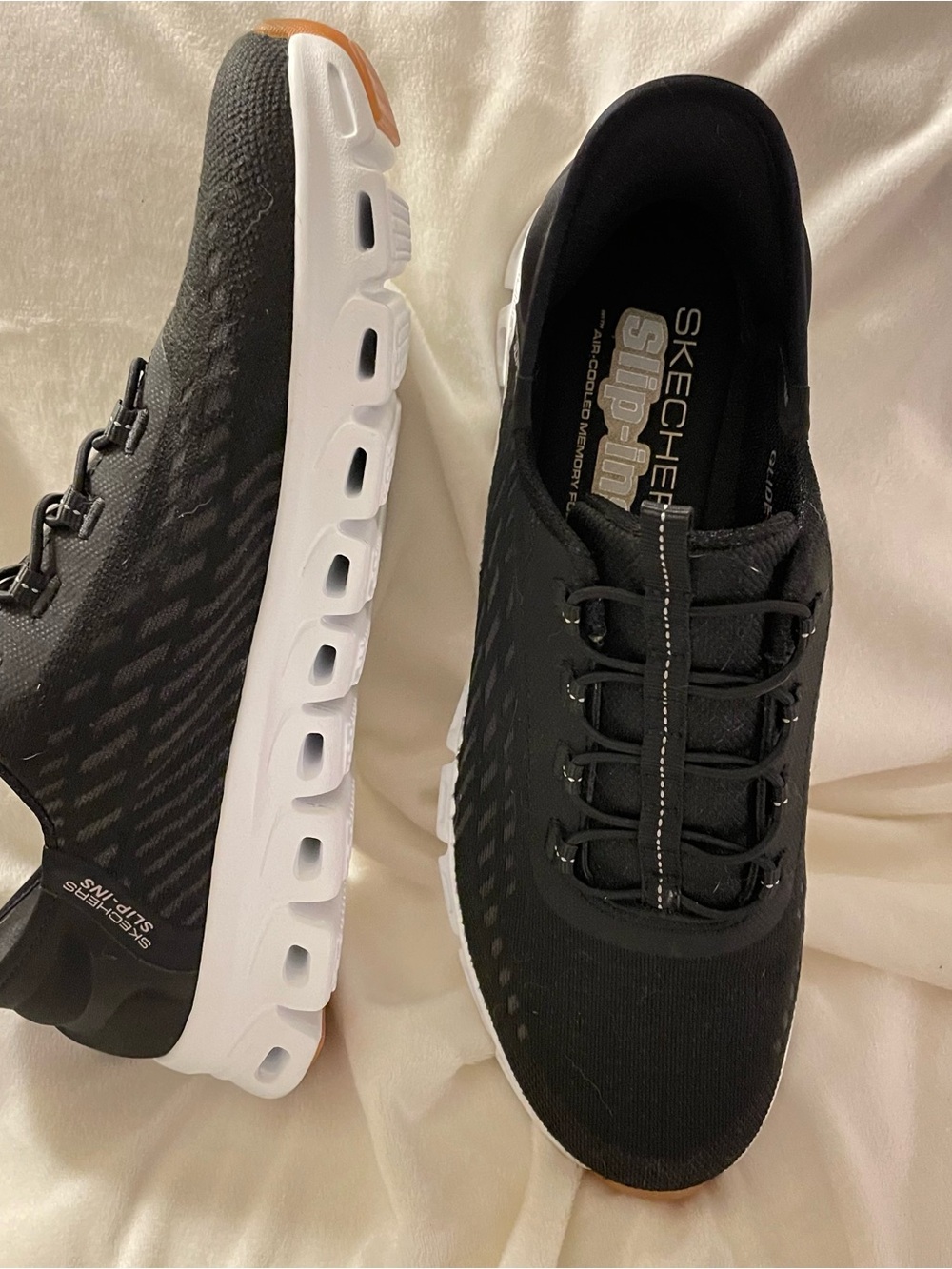 Skechers Black and White Slip-On Athletic Sneakers with Gum Accent